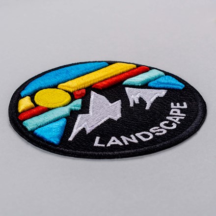 3D Embroidered mountain landscape patch laid at a hard angle