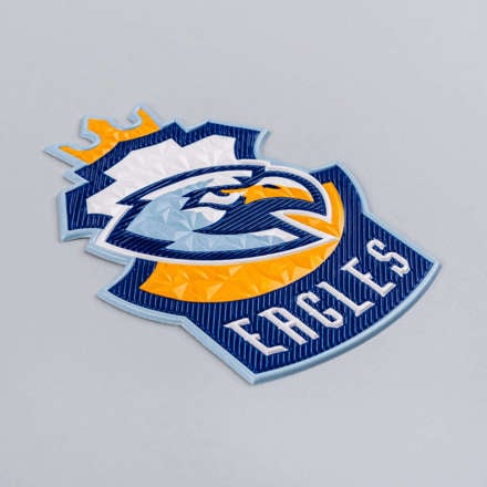 FlexStyle Beveled Non-Metallic eagles emblem laid at a hard angle