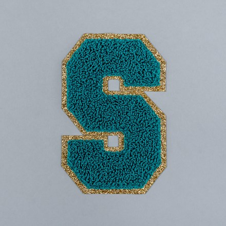 Chenille S patch laid flat