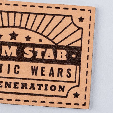 Natural Genuine Leather with high contrast denim star patch close up