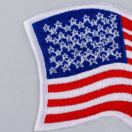 Embroidered Wavy American Flag Patch with white border close up