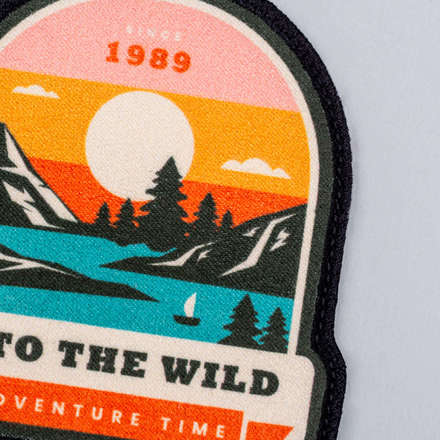 Sublimated Faux Suede Into the Wild Adventure Patch close up