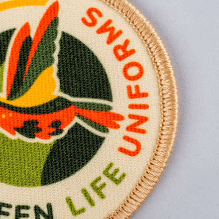 Sublimated Green Life Uniforms patch close up