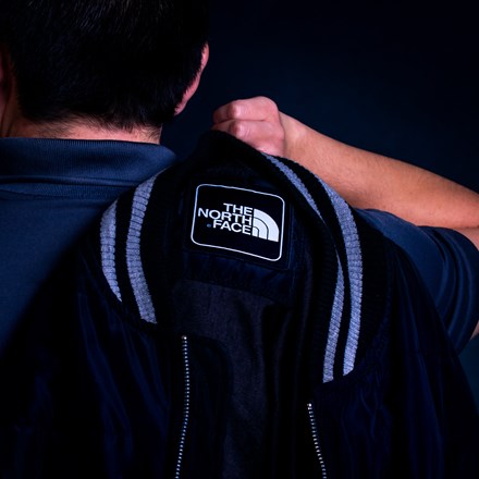 Woven Patch Applied to Backpack Over Man's Shoulder