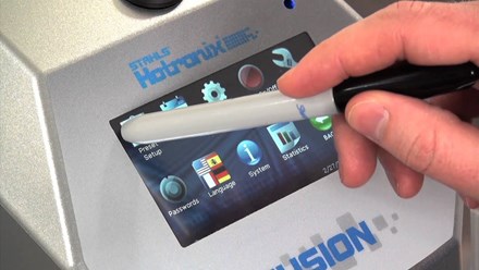 Close up of person's hand holding a sharpie up to the Hotronix Air Fusion IQ Heat Press's digital screen